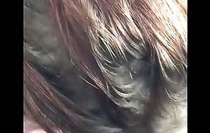 Young redhead sucking black dick
