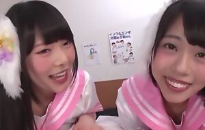 Two smiley Asian girls suck delusional unaware throbbing cock in POV